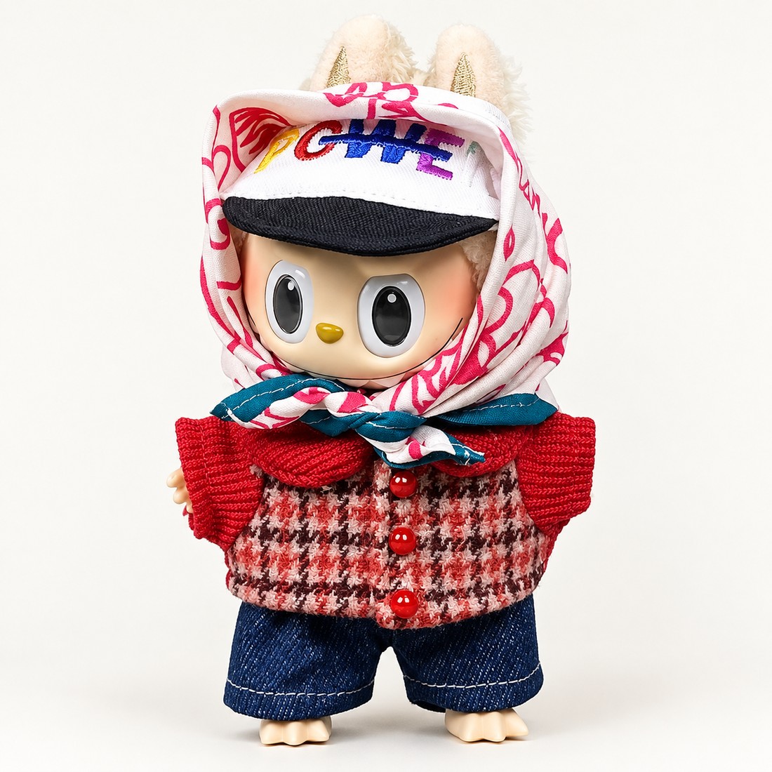 Plush doll wearing houndstooth headscarf tied under the chin with embroidered baseball cap — plush toy clothes sized 15-25 cm