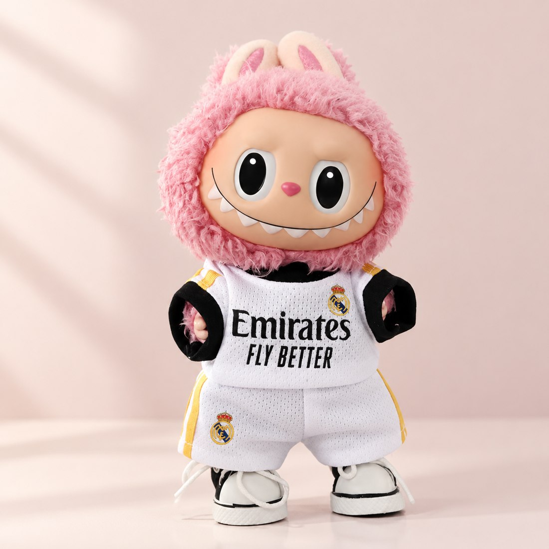 Plush doll wearing soccer and basketball sport jersey outfit