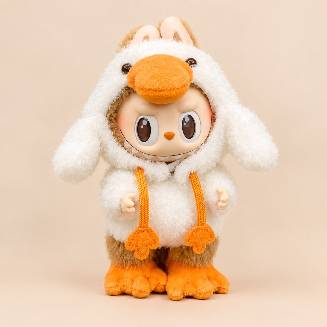 Plush doll wearing yellow duckling costume