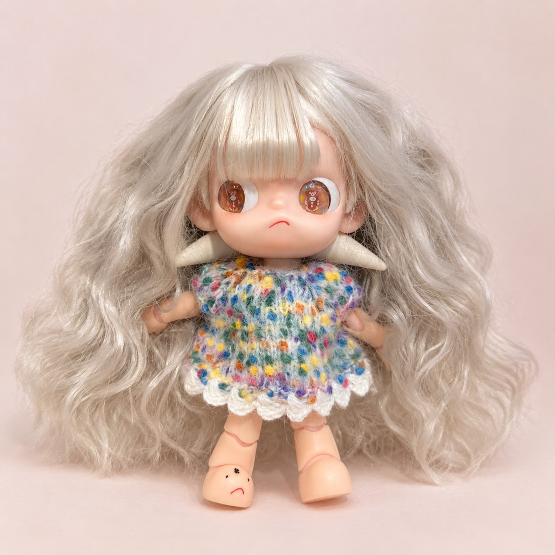 Tiny hand-crochet dress on a small 10cm cotton doll