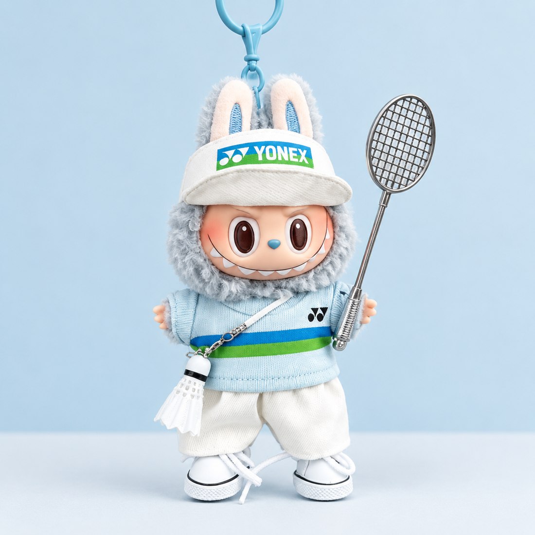 Plush doll wearing sport kit with mini racket and shuttlecock