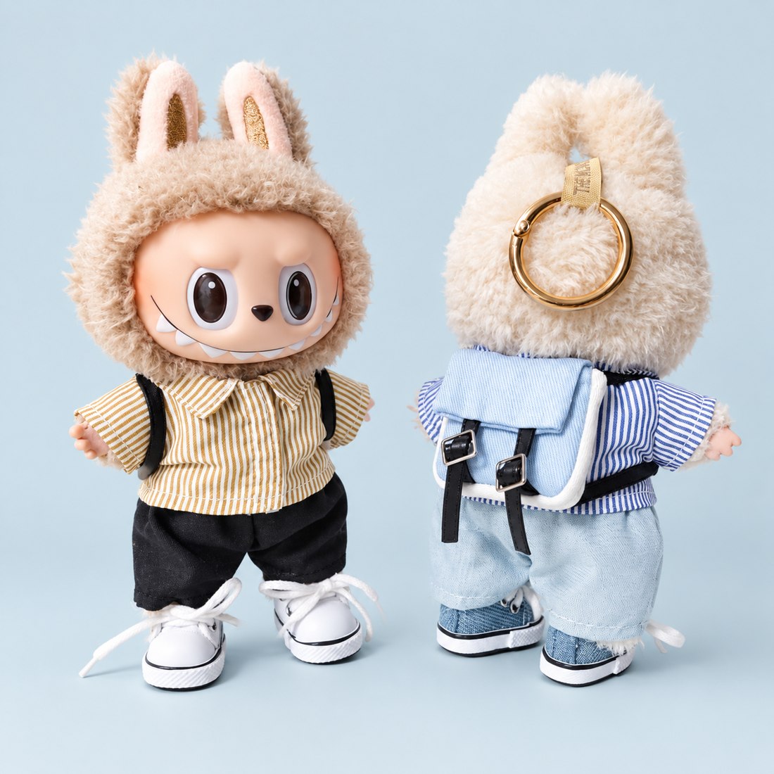 Plush doll wearing sailor stripe outfit with bag