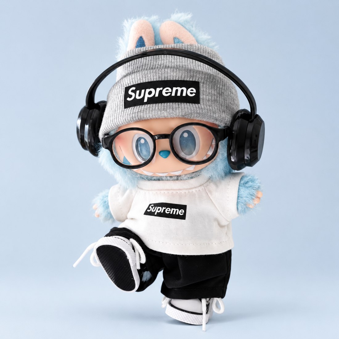 Plush doll wearing all-black sporty outfit with earphones