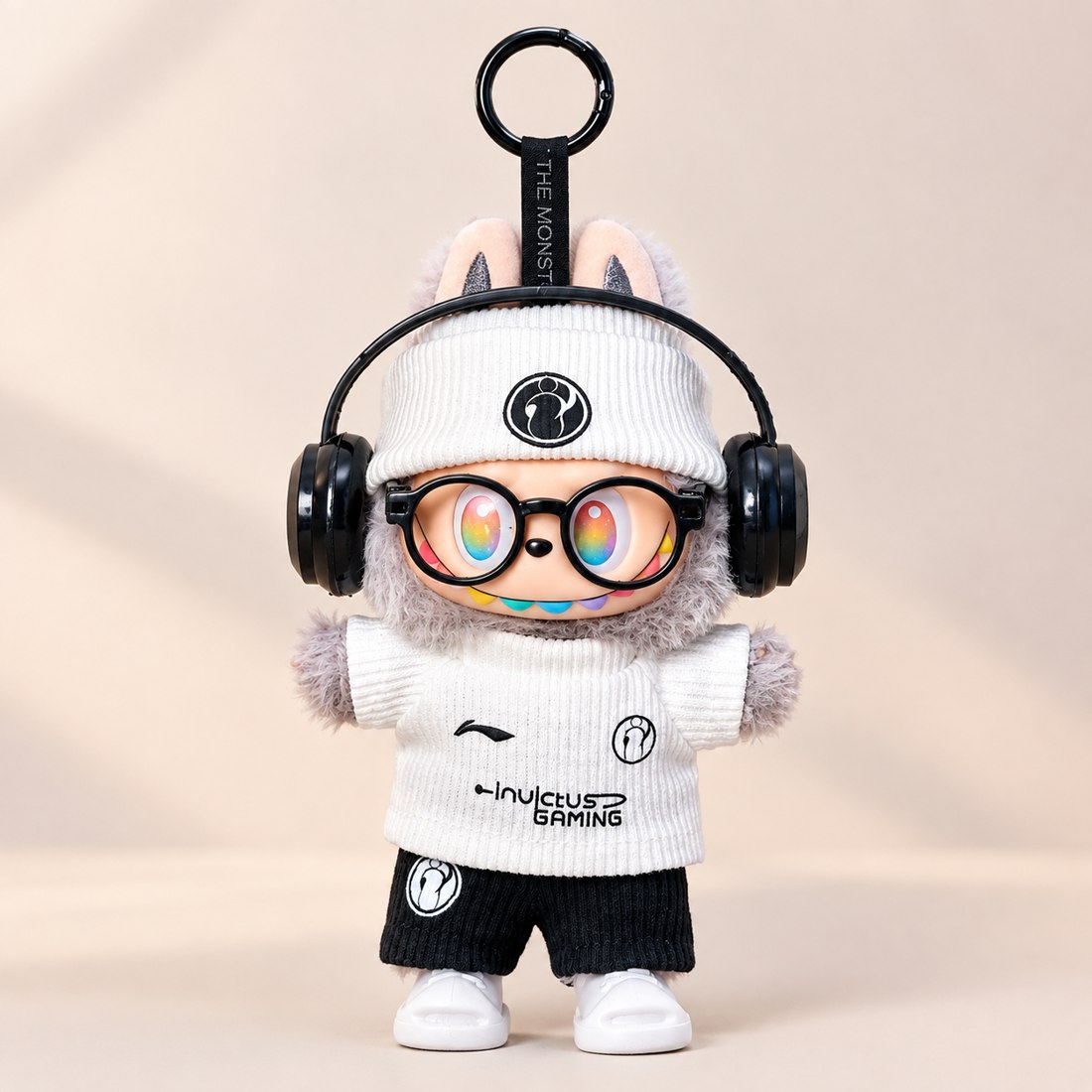Plush doll wearing ribbed knit varsity jersey with mini ball